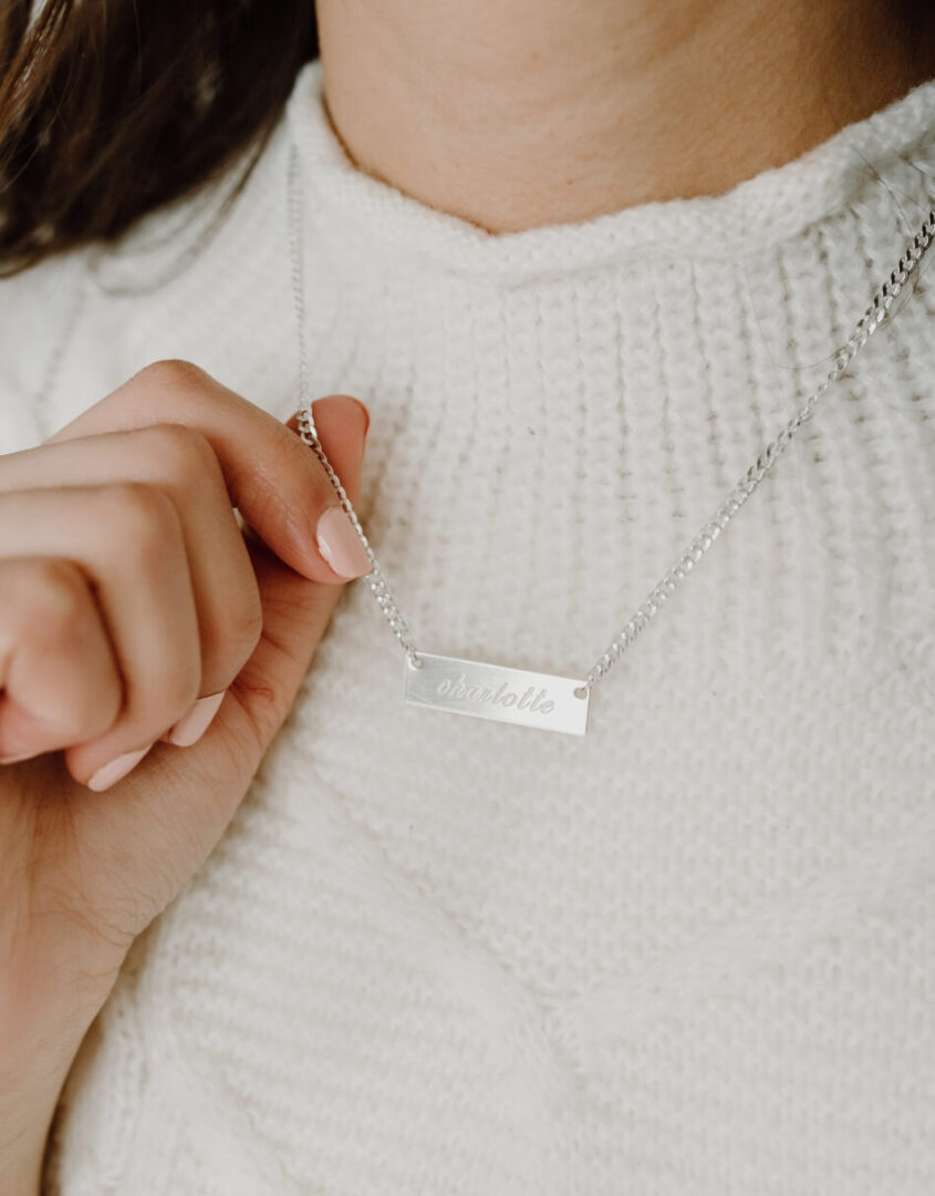 Image of model wearing Engraved Sterling Silver Name Bar Necklace