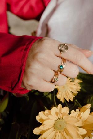Image of model wearing stack of rings that are personalized