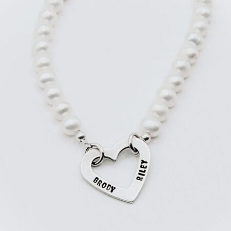Necklace personalized with name on a heart charm made with Freshwater Peals