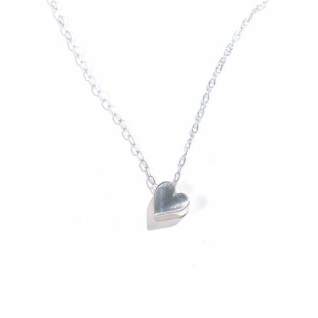 Sterling silver heart hung on a beautiful sterling silver dainty chain. Perfect way to show love to that special person
