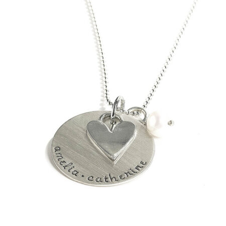 Hand stamped sterling silver disc along with a heart charm and a freshwater pearl. Perfect gift for mom, grandma
