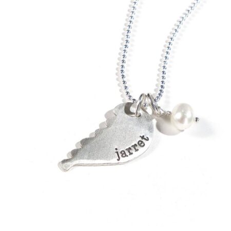 Sterling silver angel wing hand stamped with name. Perfect personalized gift for mom, grandma