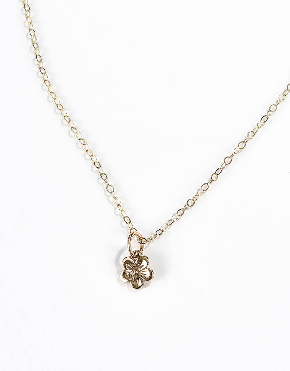 A beautiful dainty yellow bronze flower hung on gold-filled chain. Perfect gift for daughter, sister, friend