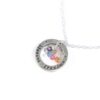 A sterling silver circle hand stamped with "blessed grandma" along with grand children birthstones. Perfect gift for a grandma