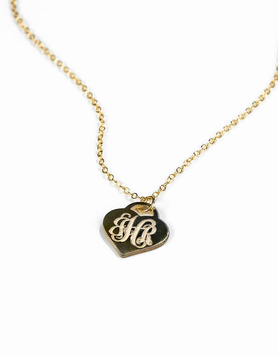 A beautiful “Tiffany” style gold plated heart monogramed with initials. Perfect personalized gift for wife, mom or grandma