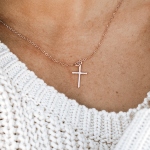 A small hand forged cross charm created with sterling silver, hung on a sterling chain. Perfect for girls of all ages.