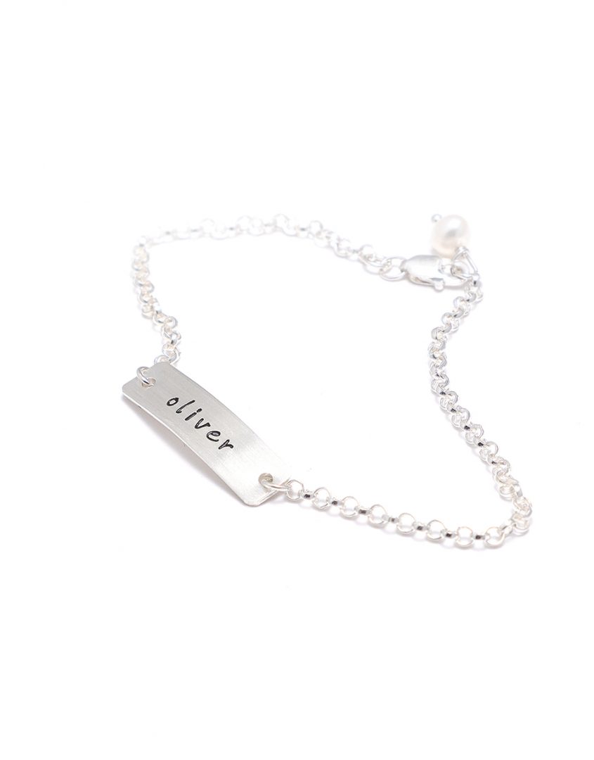 A sterling silver rectangle charm bracelet with name engraved on it. Great gift for daughter, sister, mom, spouse