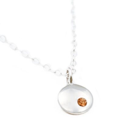 Sterling silver dainty disc necklace embedded with a beautiful birthstone crystal. Perfect gift for mom, wife, sister