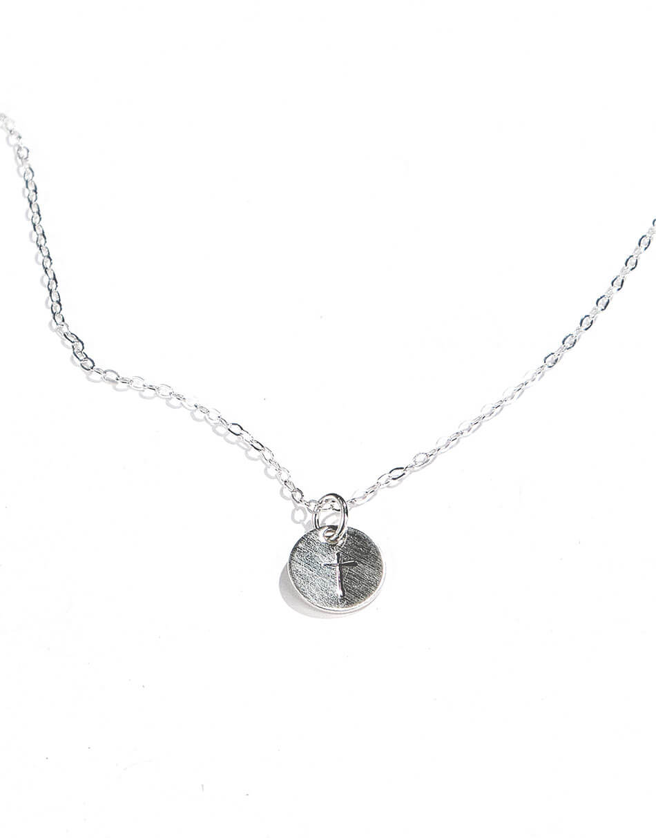Sterling silver disc hand-stamped with a cross and hung on a pretty dainty chain. The perfect necklace for your wife, daughter, or mom.