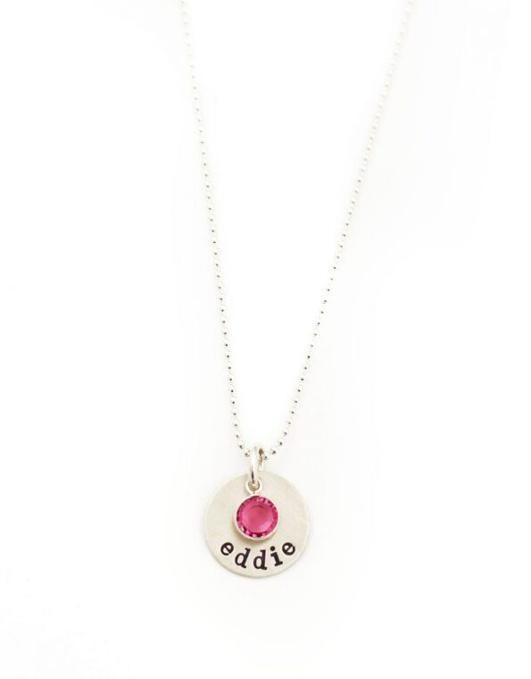 Sterling Silver Necklace with circle charm and name engraved. It has a birthstone attached.