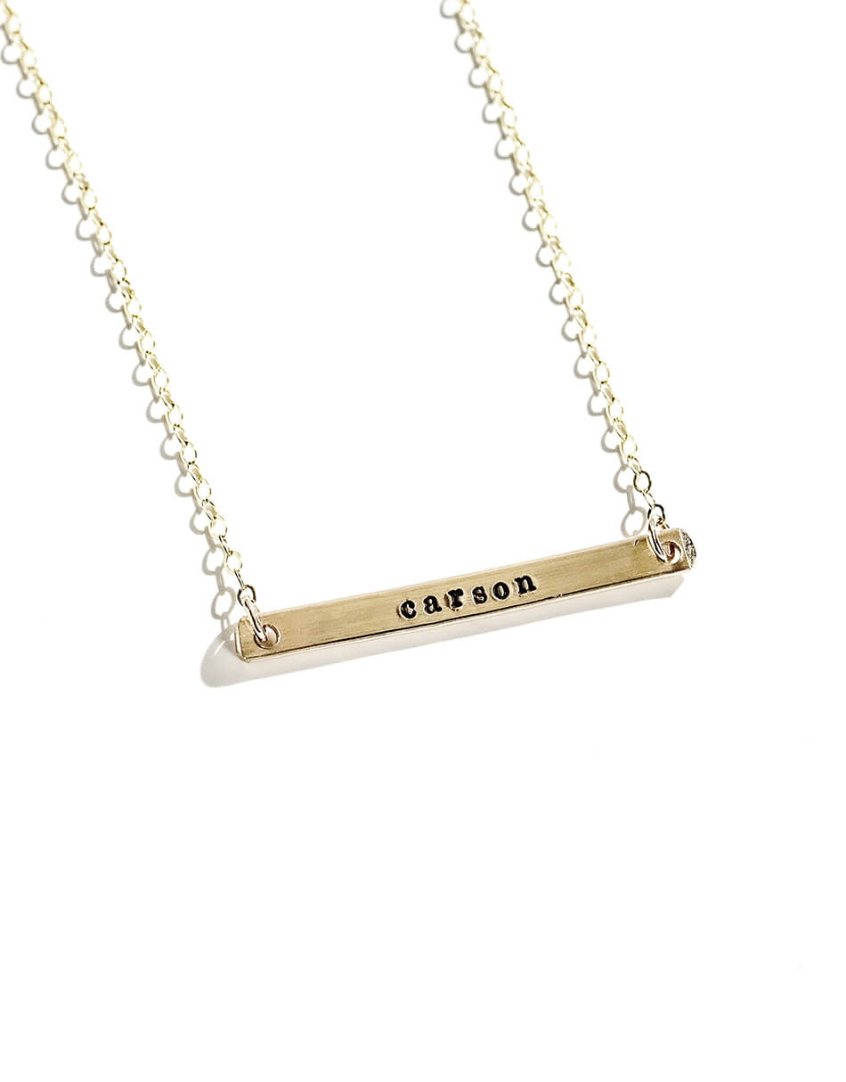 Dainty bar made in sterling silver or beautiful gold hung on a dainty chain with individually hand-stamped letters. Perfect gift for moms