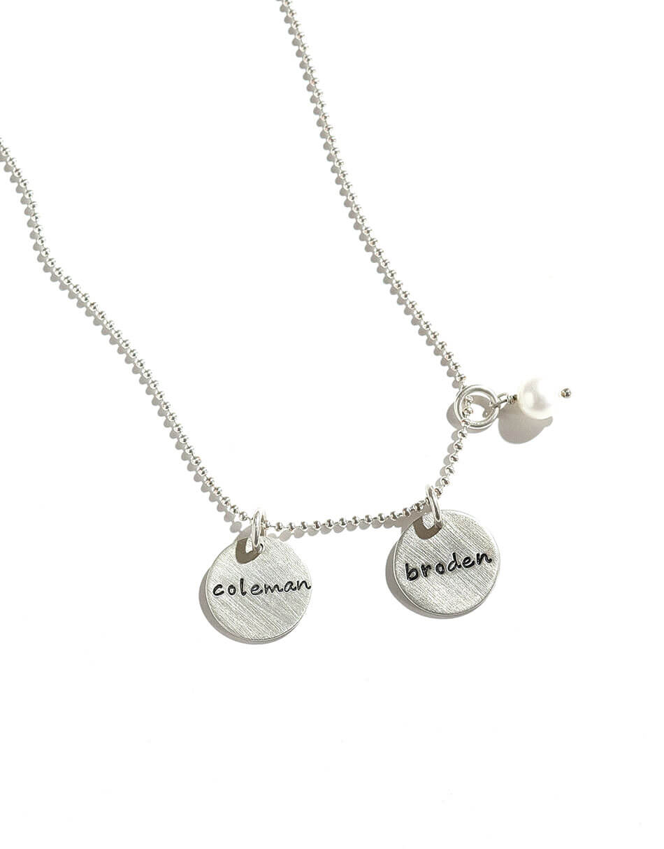 Sterling Silver dainty disc with hand stamped names. Perfect gift for mom, wife