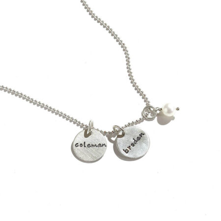 Dainty sterling silver disc with hand stamped names. Personalize the necklace by adding more charms