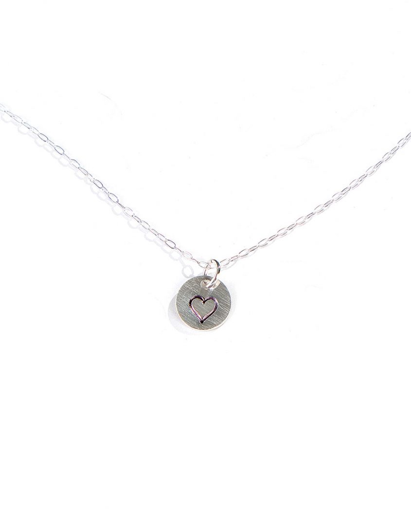 Beautiful sterling silver disc with a hand-stamped heart hung on a pretty dainty chain. A great reminder of eternal love in our lives.
