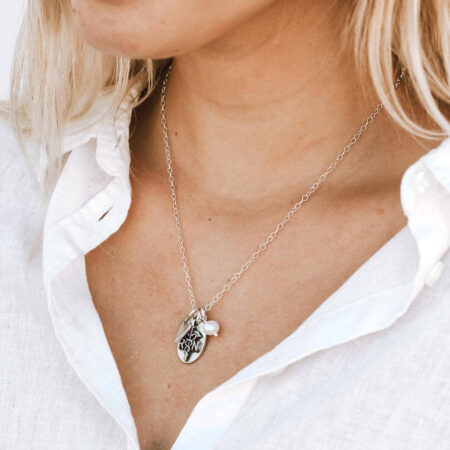 Unique handmade charms created in fine pewter and hung on your choice of chain with a freshwater pearl