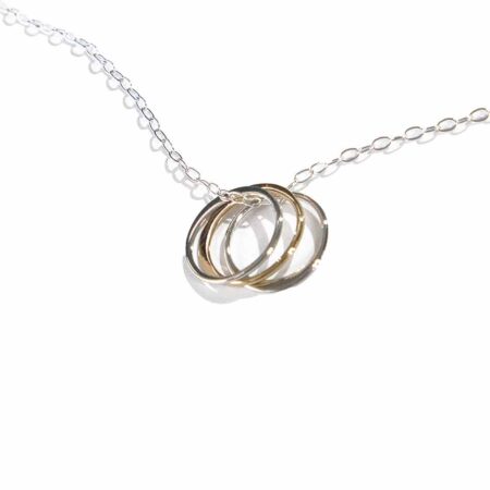 2 sterling silver circles and 1 gold-filled circle, hung on a sterling silver dainty chain. This necklace is symbolic as well as stunning