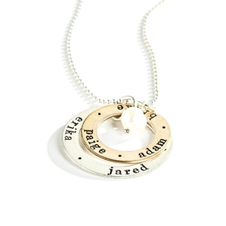 A sterling silver circle and a gold-filled circle, both with hand stamped names or dates. Personalized necklace gift option for wife, mom, grandma