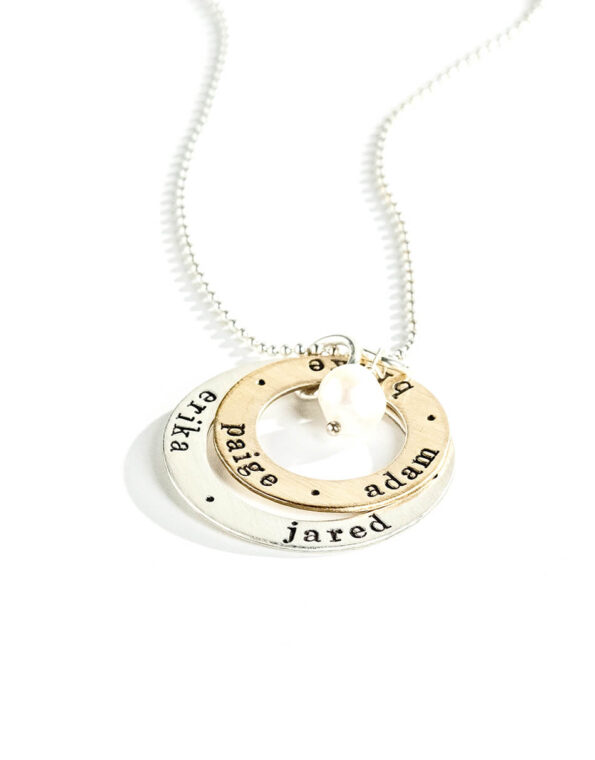 A sterling silver circle and a gold-filled circle, both with hand stamped names or dates. Personalized necklace gift option for wife, mom, grandma