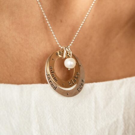 2 layers of circle, one sterling silver and one gold-filled, both hand stamped with names. Perfect for grandma, mom