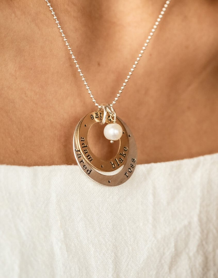 2 layers of circle, one sterling silver and one gold-filled, both hand stamped with names. Perfect for grandma, mom