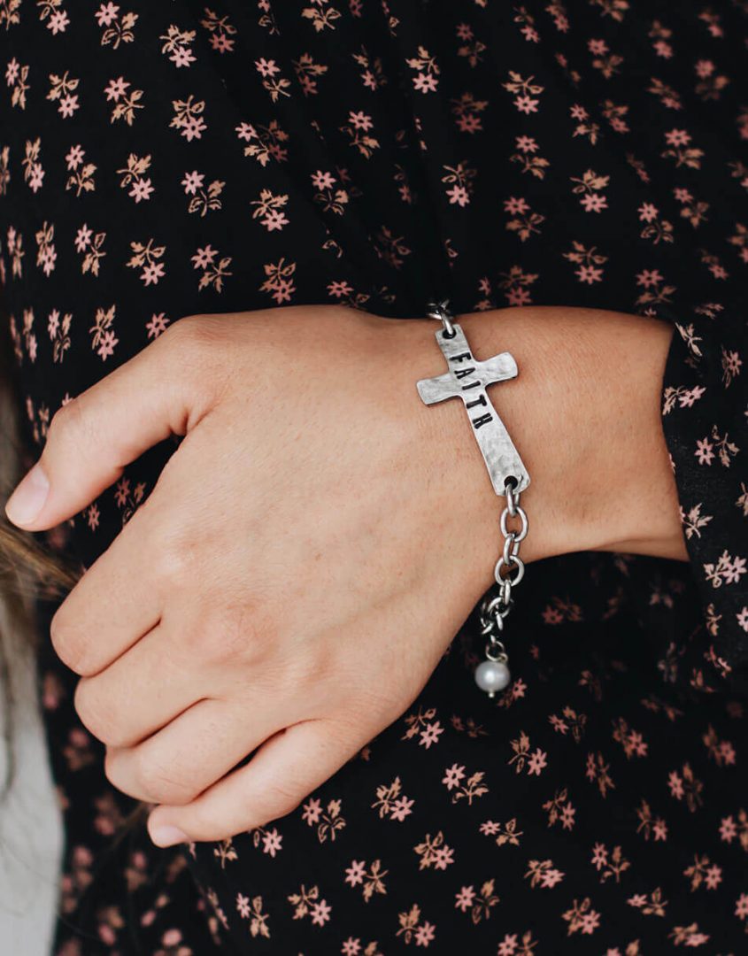 A handcrafted chunky cross created in fine pewter, hammered and stamped “FAITH”. Cross Bracelet for your loved ones