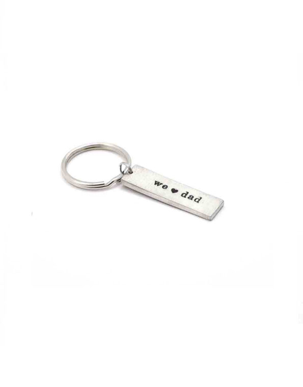 Made in fine pewter, hand-stamped with personalized words and hung on a keyring. Customize this with I or we heart dad, grandpa, papa, pops