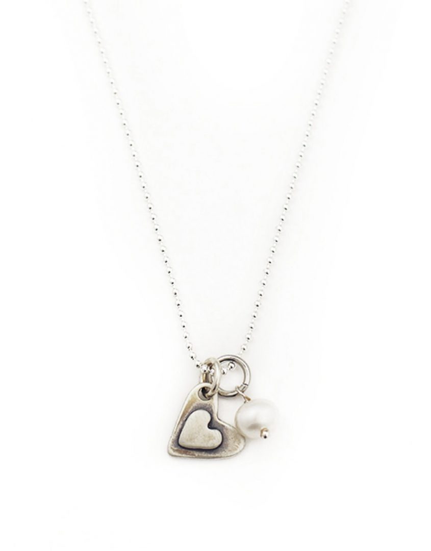 2 small sterling hearts layered with a simple message hand stamped “i love you more”. Perfect gift for wife, fiancee