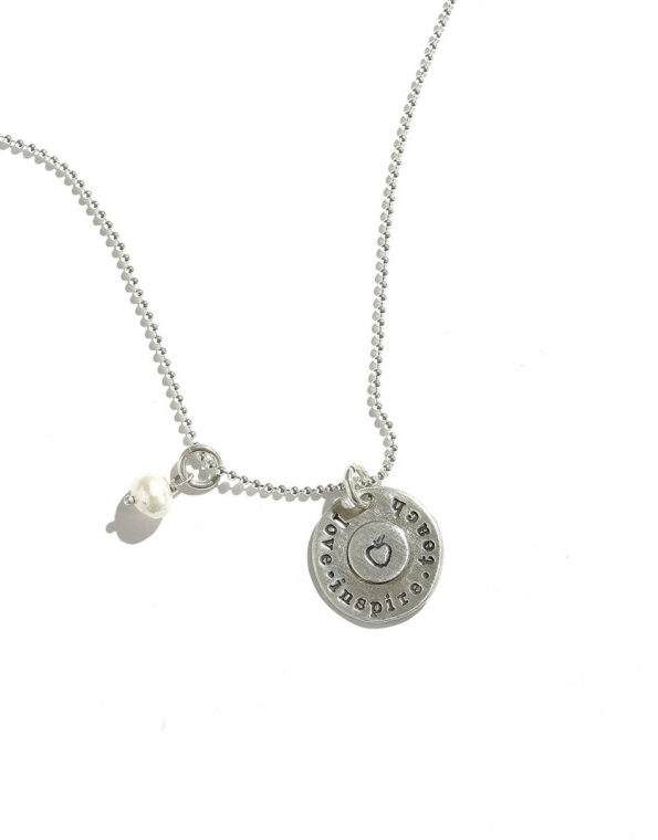 Sterling silver disc with “Love.Inspire.Teach” message and an apple in the center. Perfect gift for your teacher.