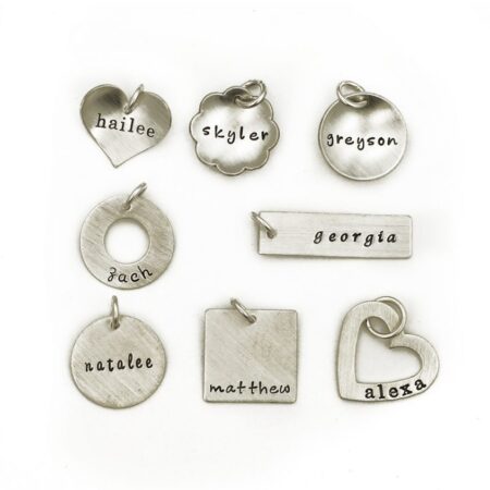 A medium size charm hand stamped with the name on a shape of your choice. Best gift for wife, daughter, friend, sister