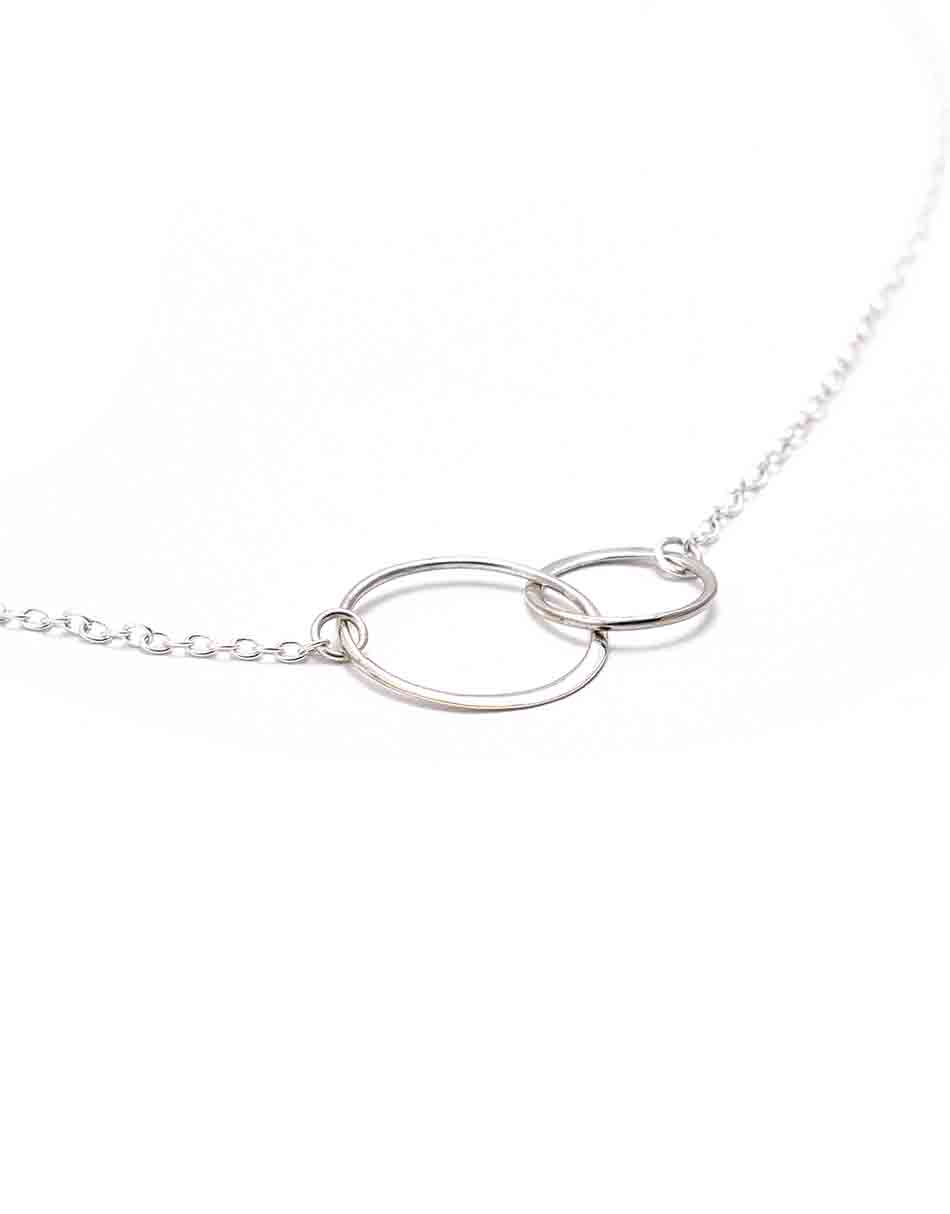 A pretty necklace to show your love to your mother in law. 2 sterling silver circles connected together and hung on a sterling silver dainty chain