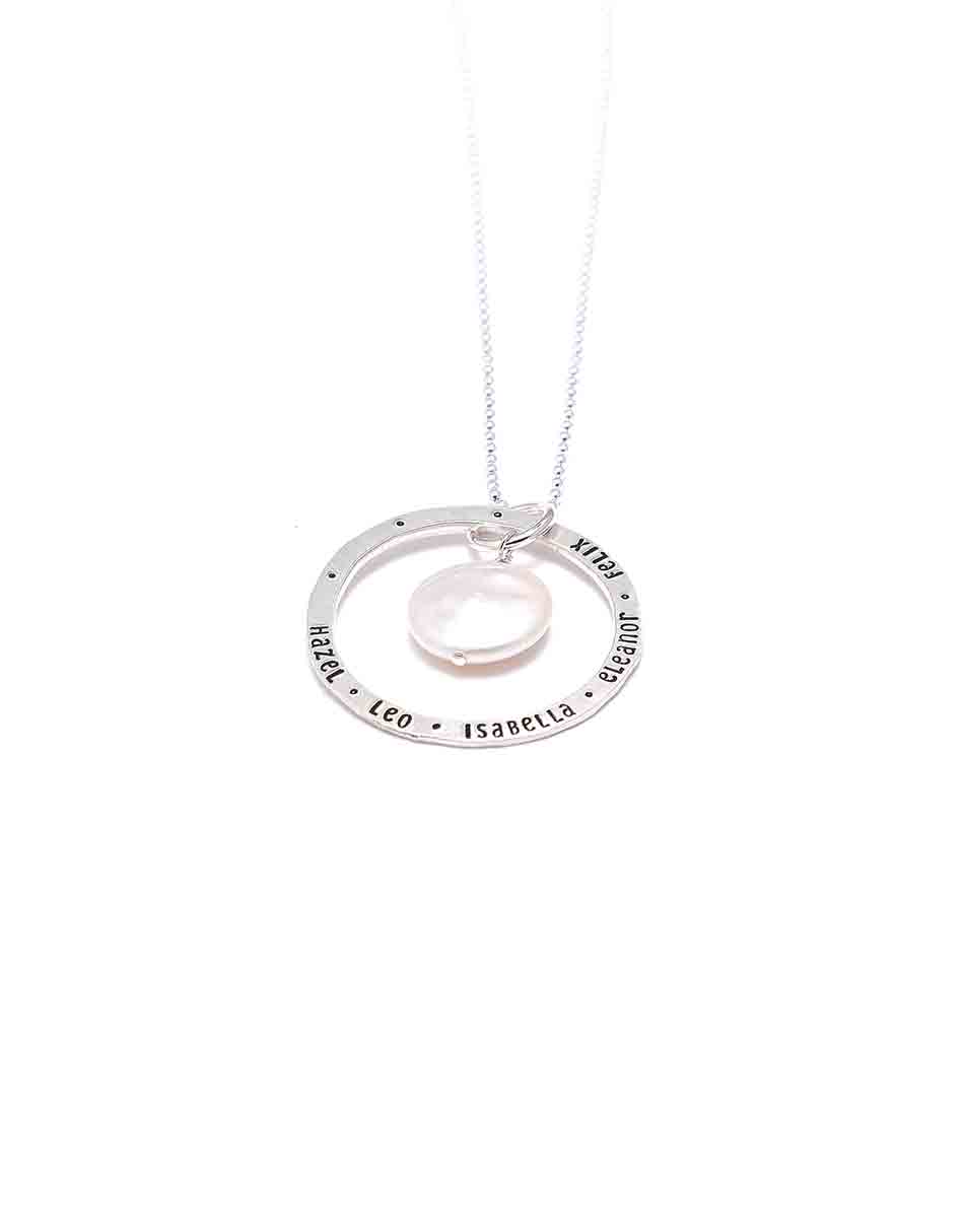 Sterling silver dainty circle with names hand stamped. Add to it is a mother of pearl. Personalized necklace for a mom