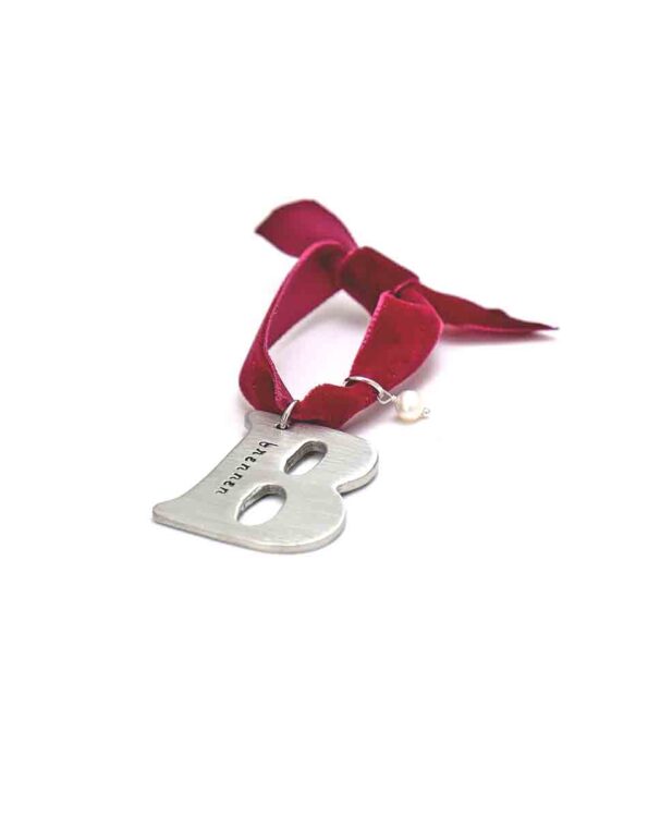 Fine pewter silver letter charm hung in a red velvet ribbon. Hand stamp with name or date. Best gift option for your loved ones