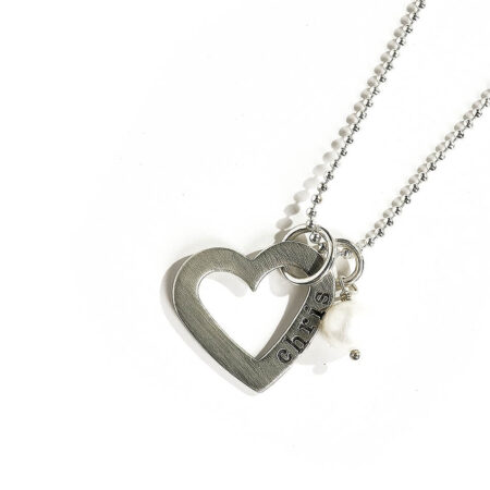 An open heart charm, hand stamped with the name of your loved one. Perfect personalized necklace for fiancée or wife