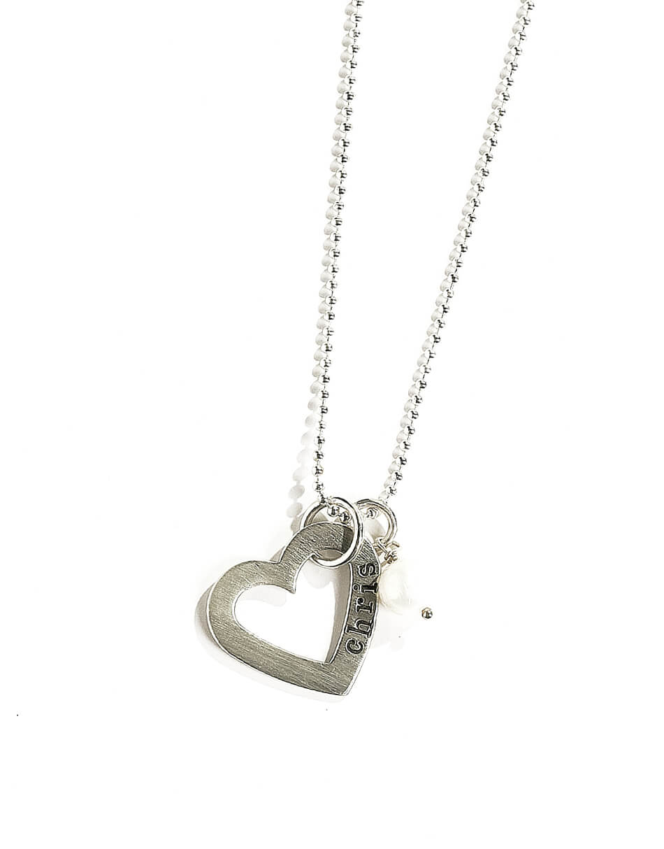 A sterling silver open heart with the name of your loved one. Great personalized gift for your wife or fiancée