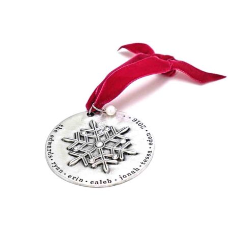 A beautiful snowflake ornament, handstamped around the edges with family names. A beautiful keepsake and personalized gift