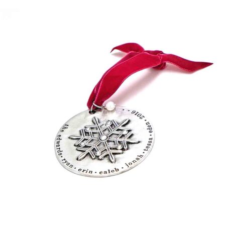 A beautiful snowflake ornament, handstamped around the edges with family names. Perfect personalized family gift