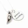 Fine pewter hand sculpted pea pod, filled with pearl “pea”. Along with a sterling silver disc hand stamped with name. Perfect gift for mom
