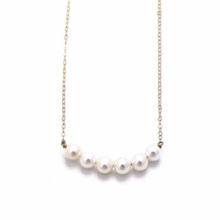 5 freshwater pearls hung together on a goldfilled or a sterling silver chain. Perfect gift for a grandma, mom or wife.