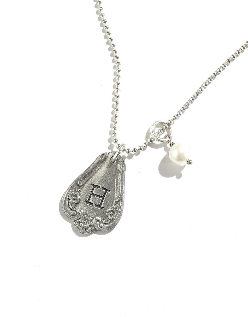 A beautiful charm necklace with hand stamped initial. Perfect personalized jewelry gift for wife, sister, daughter