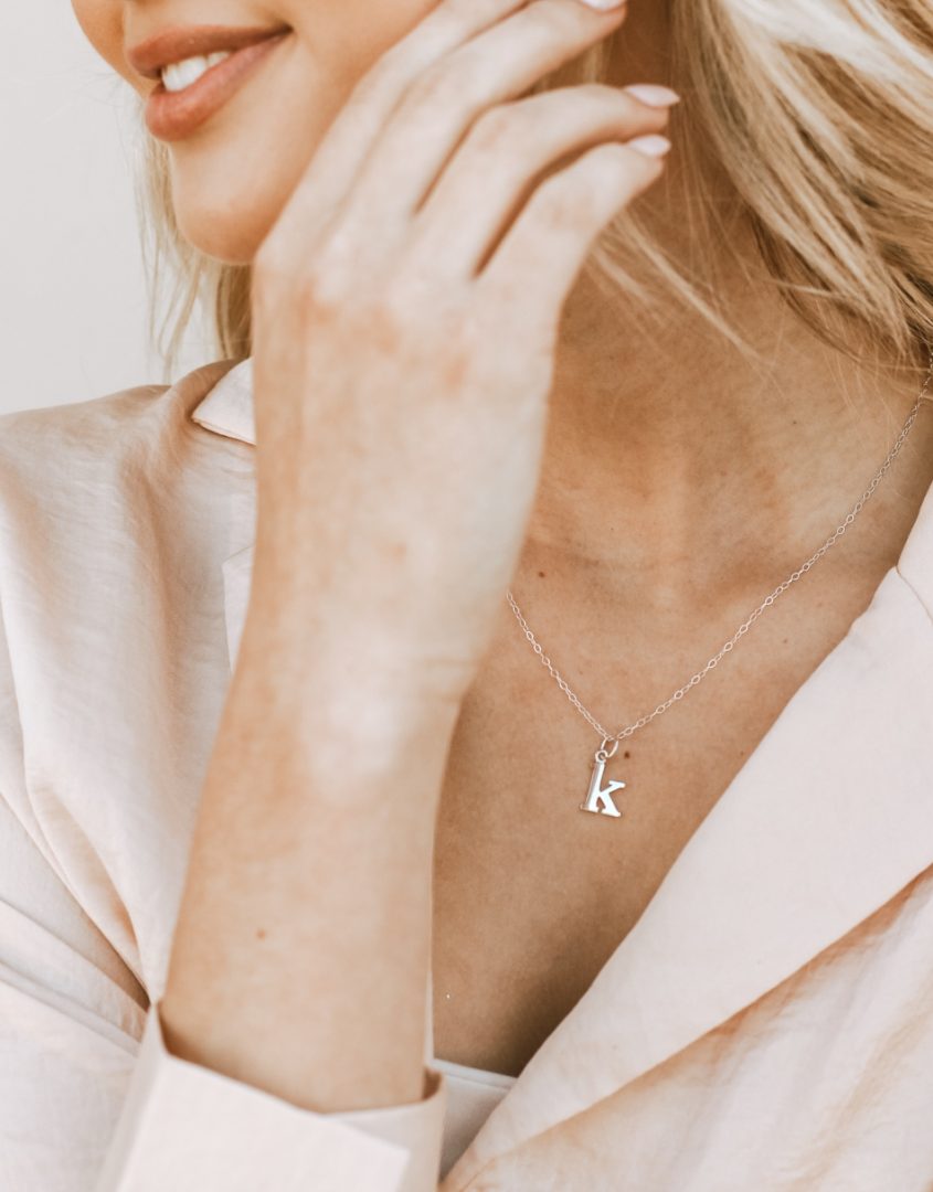 A dainty sterling silver necklace with lowercase typewriter initials. Perfect gift on family occasion or grandma, mom