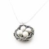 Freshwater pearls messily wrapped in antiqued sterling silver wire. Each egg representing 1 kid. Perfect gift for mom, grandma